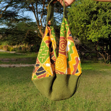 Load image into Gallery viewer, Made from hessian and African print fabric. Magnetic clasp closure. Matching lining, included hessian zip pouch for easy find of your small items.