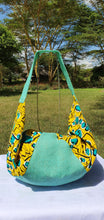 Load image into Gallery viewer, Turquoise hessian and matching African print (cotton). Seamless zip closure.