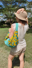 Load image into Gallery viewer, Turquoise hessian and matching African print (cotton). Seamless zip closure.