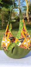 Load image into Gallery viewer, Made from hessian and African print fabric. Magnetic clasp closure. Matching lining, included hessian zip pouch for easy find of your small items.